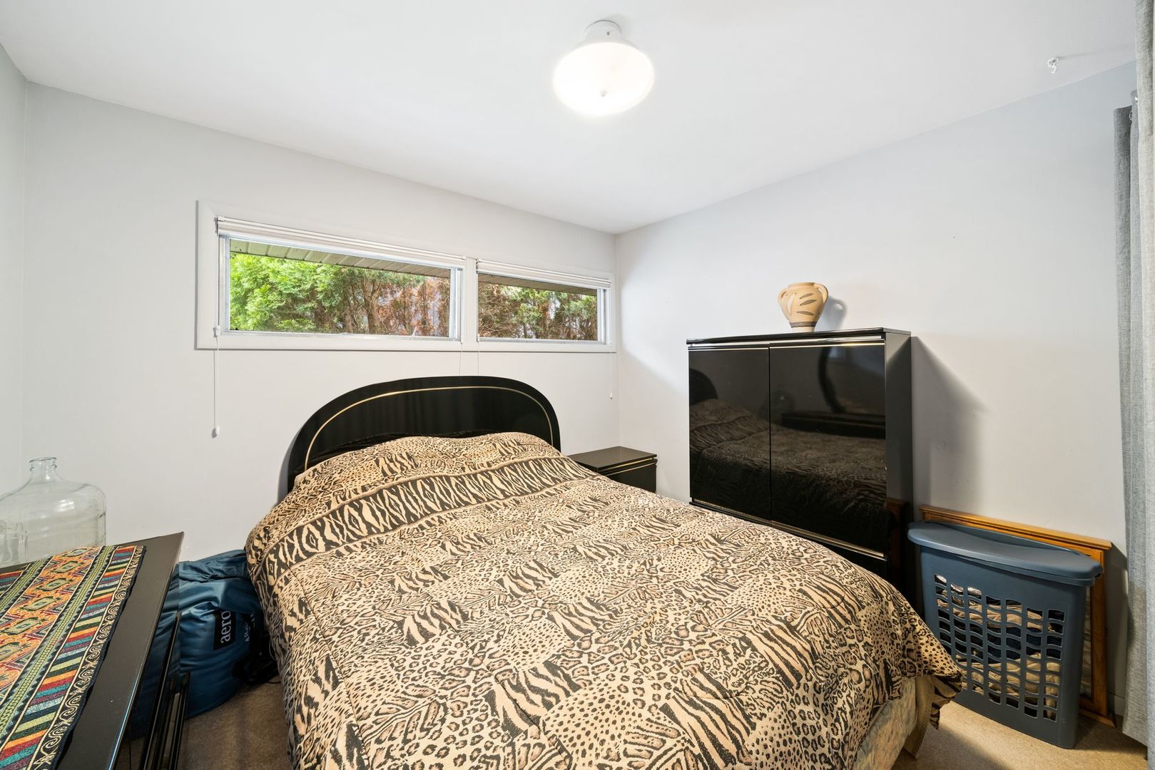 1515 North River Road McHenry, IL 60051 - Photo 12 of 27 a bedroom with a bed and a fireplace