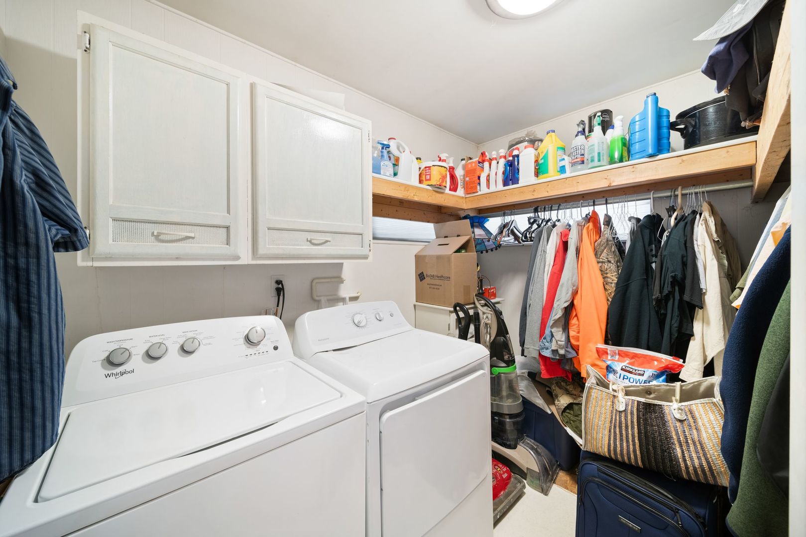 1515 North River Road McHenry, IL 60051 - Photo 14 of 27 a view of walk in closet with clothes and shoes