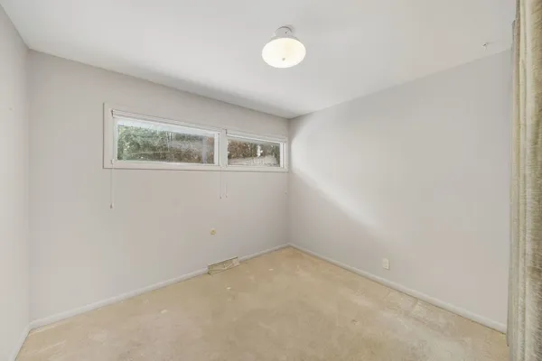 an empty room with a workbench