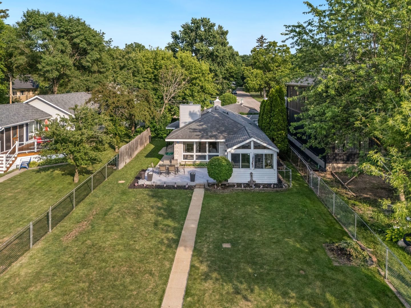 1515 North River Road McHenry, IL 60051 - Photo 26 of 27 a aerial view of a house next to a big yard and large trees