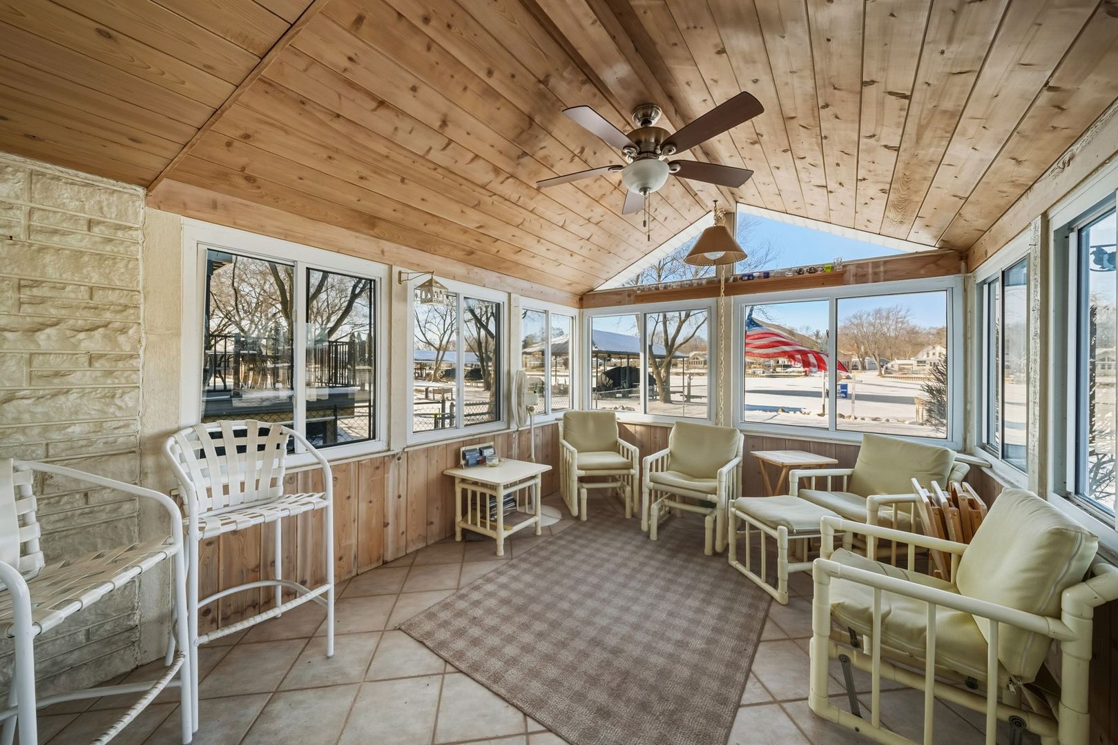 1515 North River Road McHenry, IL 60051 - Photo 27 of 27 a room with lots of white furniture and a chandelier