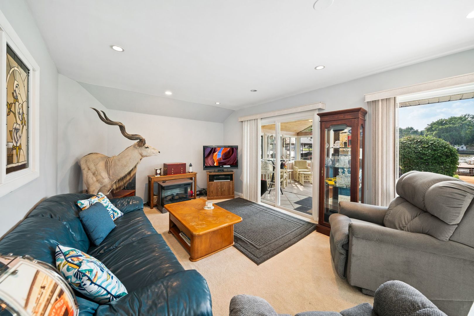 1515 North River Road McHenry, IL 60051 - Photo 3 of 27 a living room with furniture and a large window