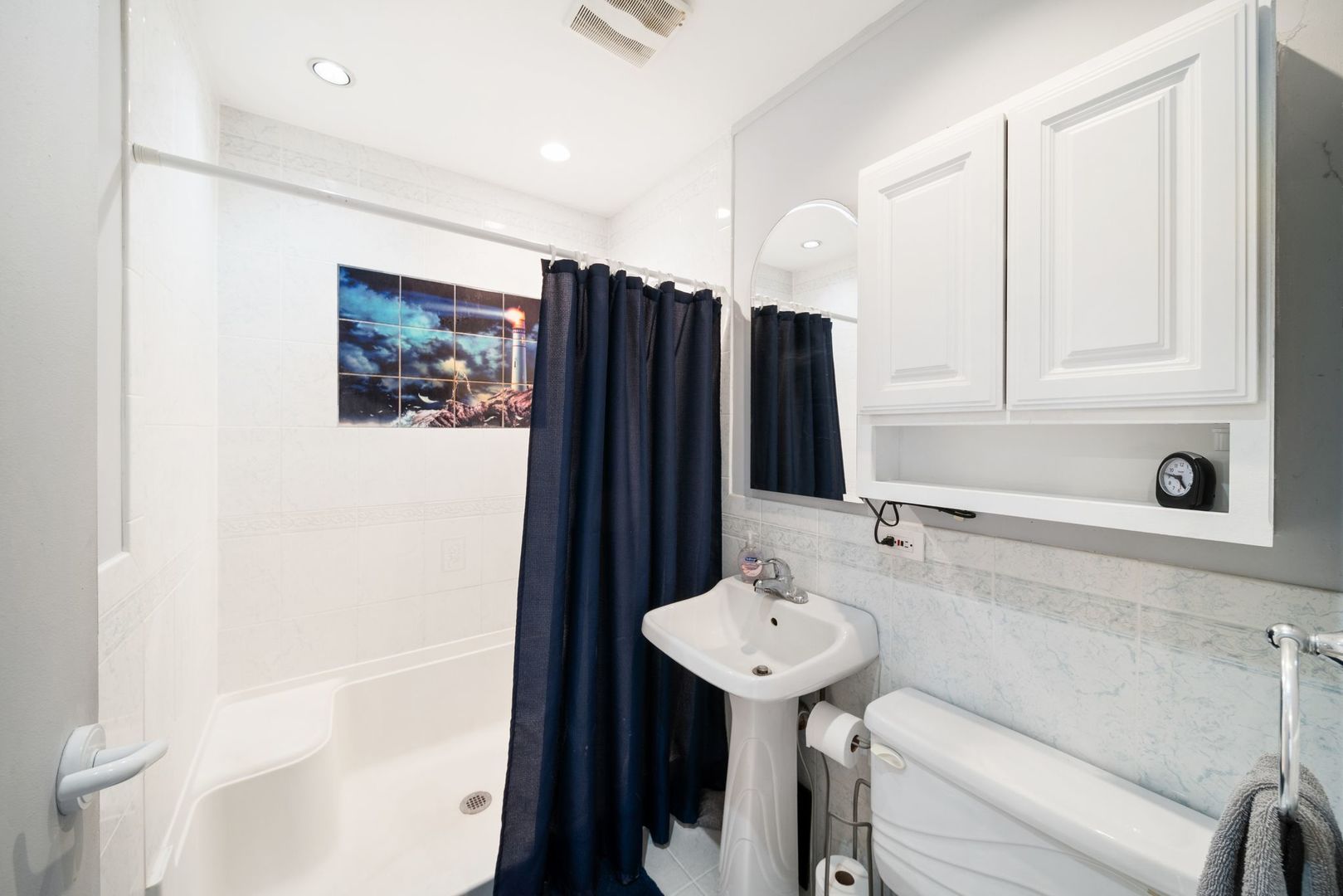 1515 North River Road McHenry, IL 60051 - Photo 5 of 27 a bathroom with a sink toilet and shower