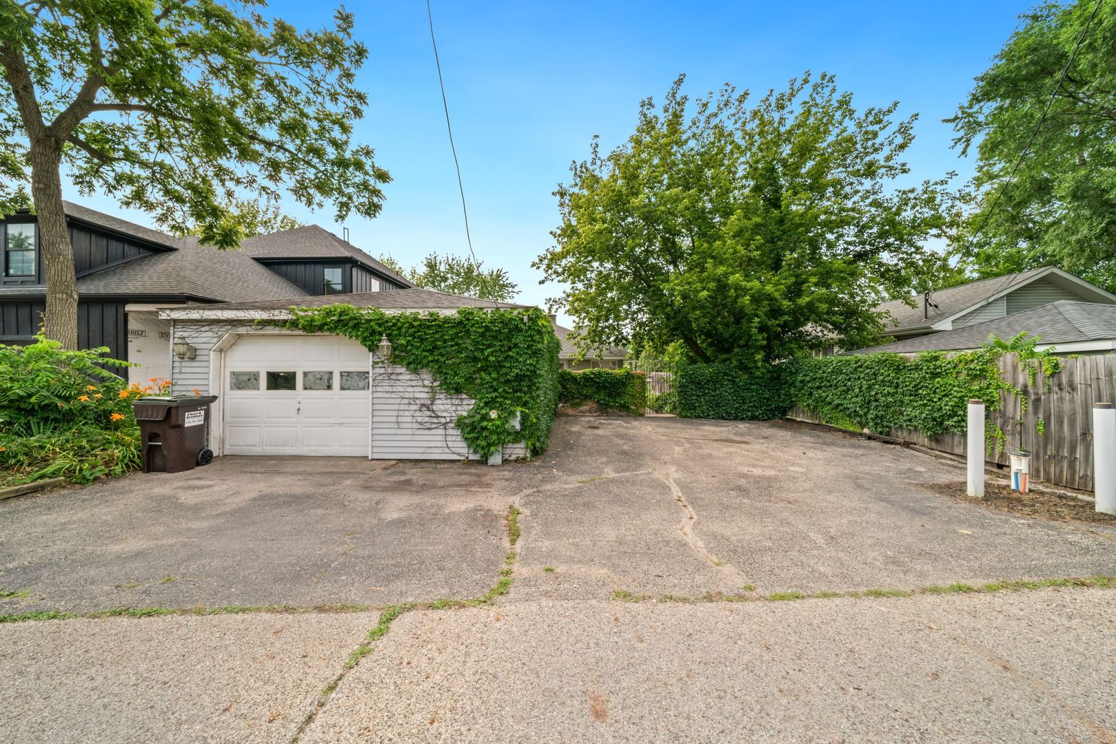 1515 North River Road McHenry, IL 60051 - Photo 6 of 27 front view of a house with a yard and a trees