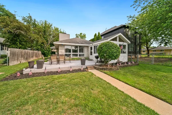 a view of a house with a yard porch and sitting area