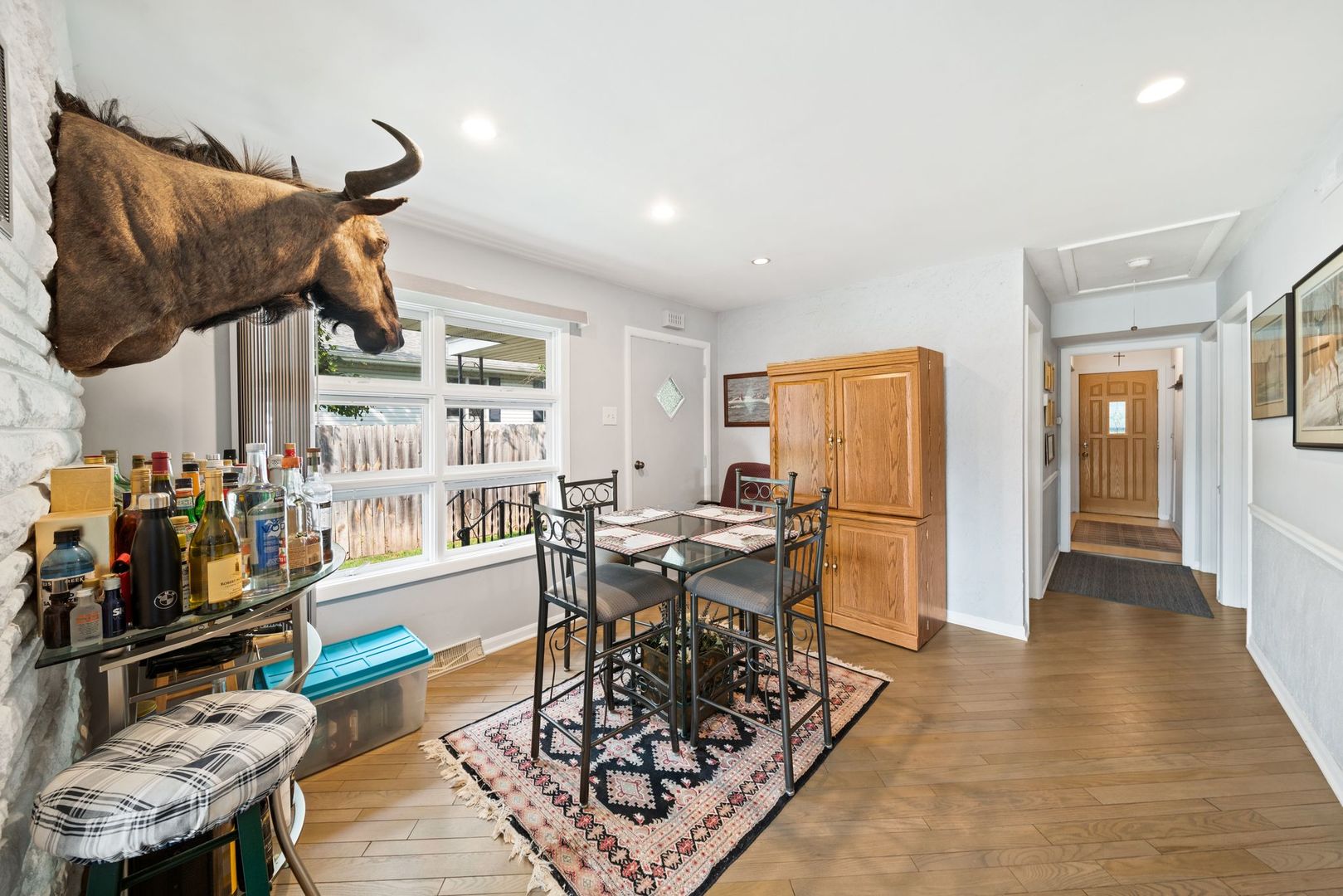 1515 North River Road McHenry, IL 60051 - Photo 10 of 27 a living room with lots of furniture and a wooden floor