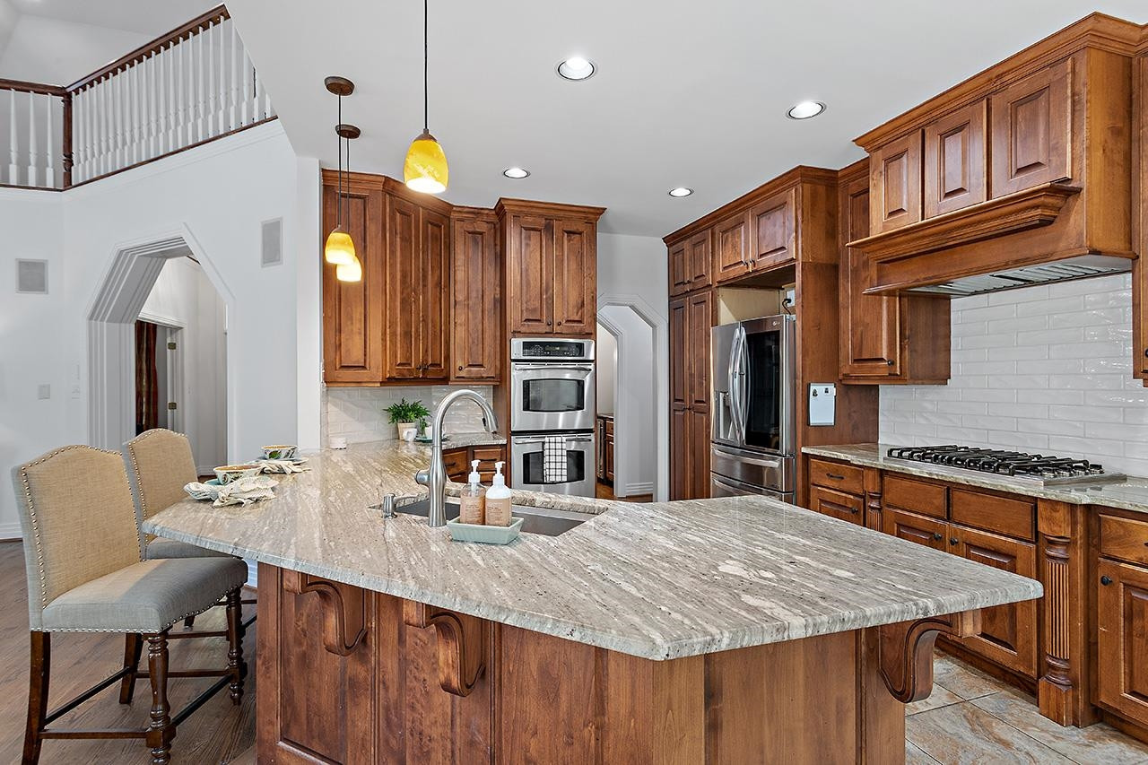 3808 White Chapel Way Raleigh, NC 27615 - Photo 18 of 46 Updated granite, stainless steel appliances, backsplash. Double wall oven