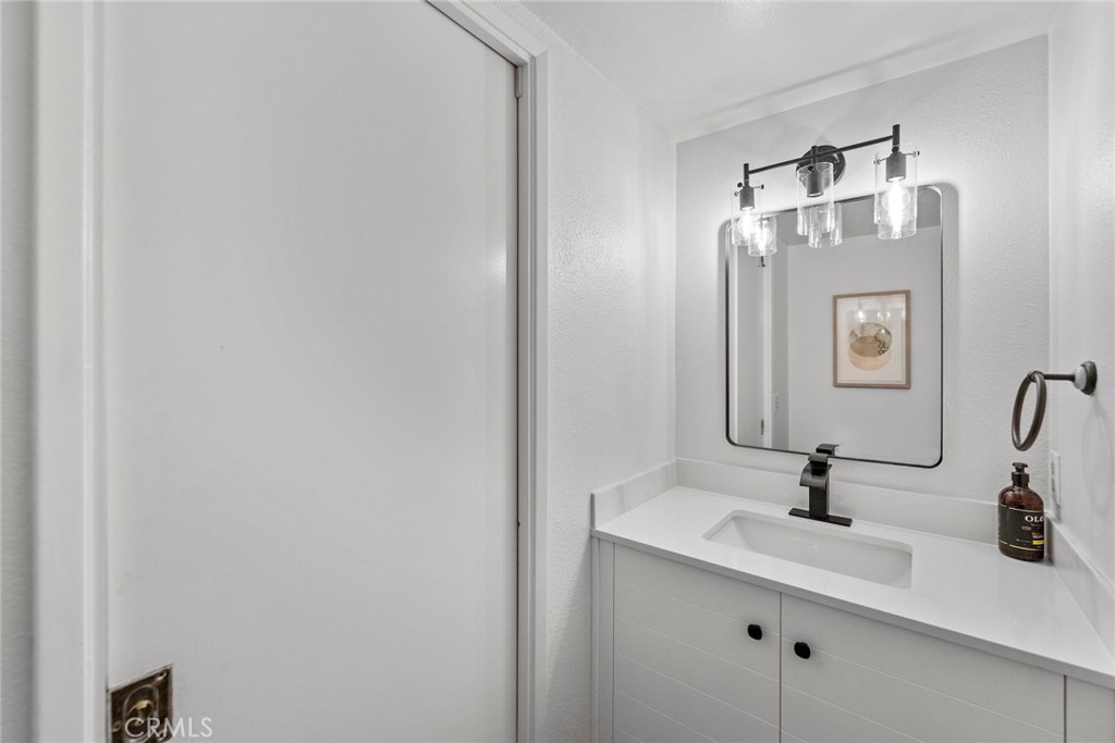 7 Boone Irvine, CA 92620 - Photo 12 of 38 a bathroom with a sink and a mirror