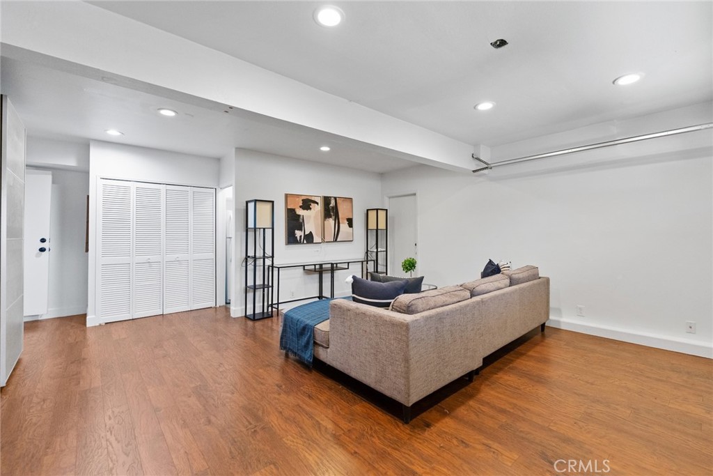 7 Boone Irvine, CA 92620 - Photo 16 of 38 a living room with furniture and a wooden floor