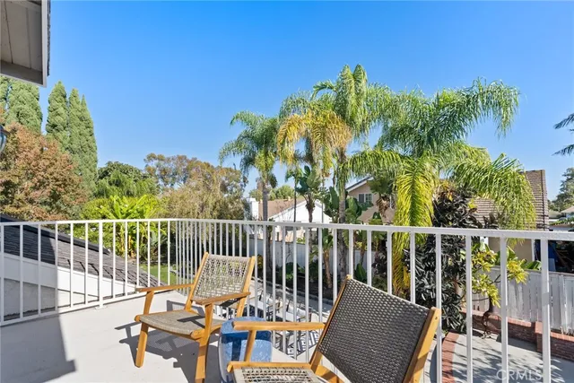 a view of a chair and table on the wooden floor
