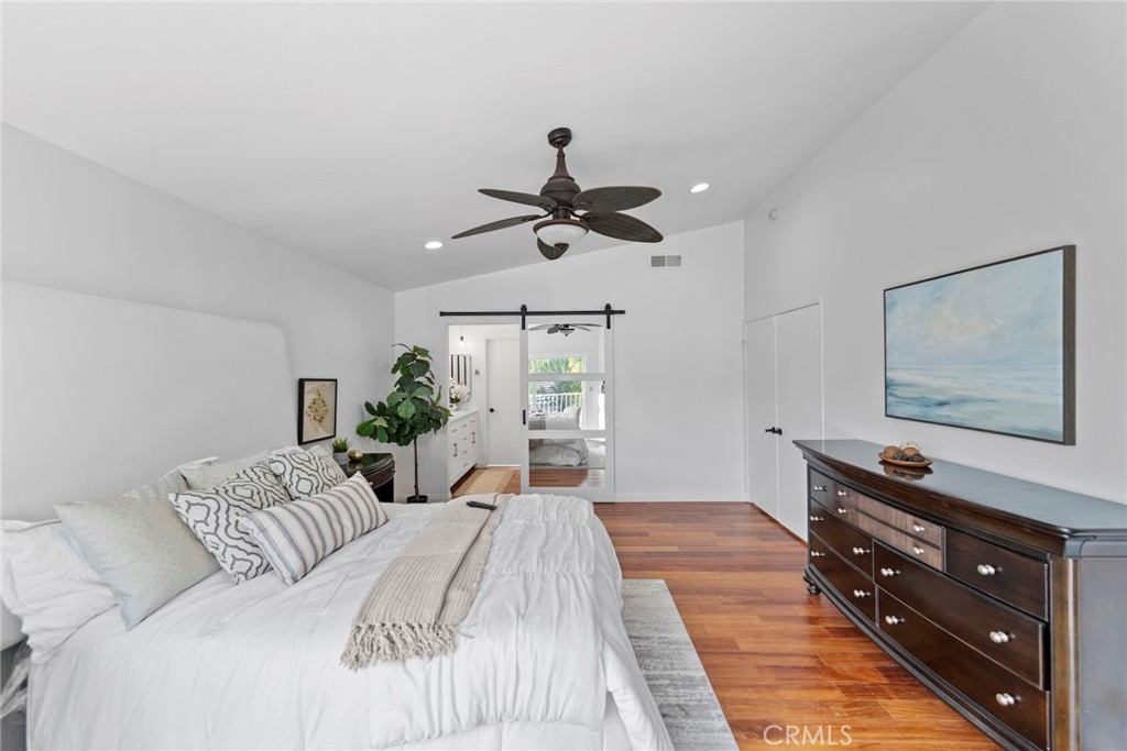 7 Boone Irvine, CA 92620 - Photo 21 of 38 a bed room with a bed and a chandelier