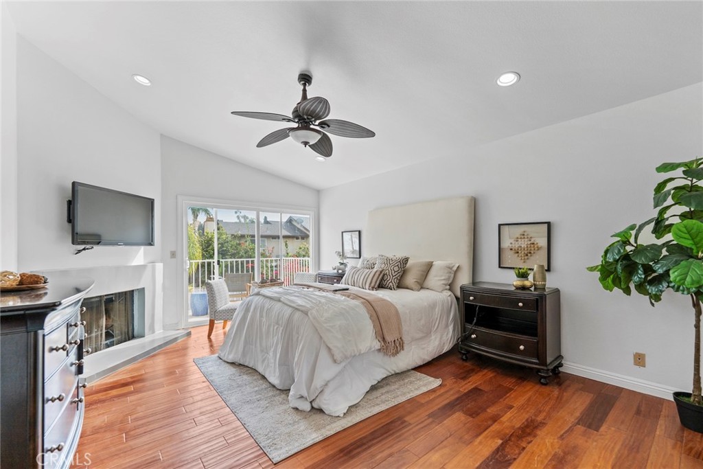 7 Boone Irvine, CA 92620 - Photo 23 of 38 a bedroom with a bed and a flat screen tv