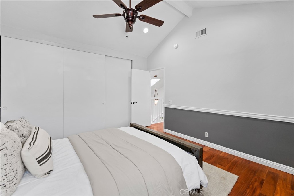 7 Boone Irvine, CA 92620 - Photo 28 of 38 a bedroom with a bed and a chandelier