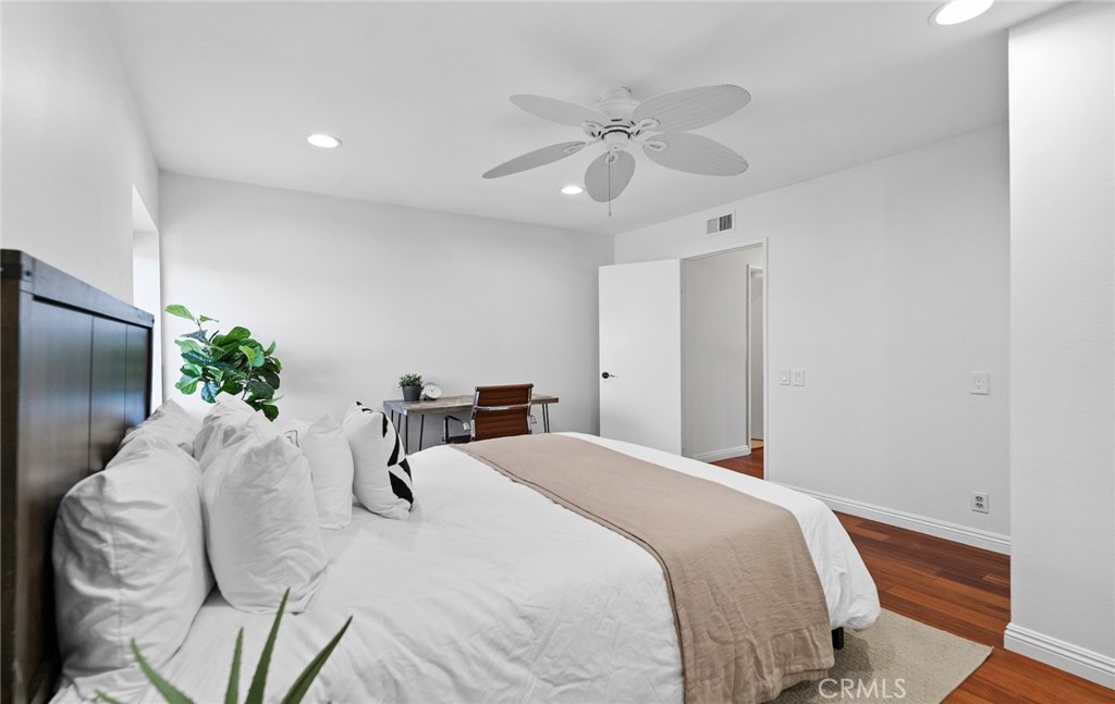 7 Boone Irvine, CA 92620 - Photo 30 of 38 a bedroom with a bed and a chandelier