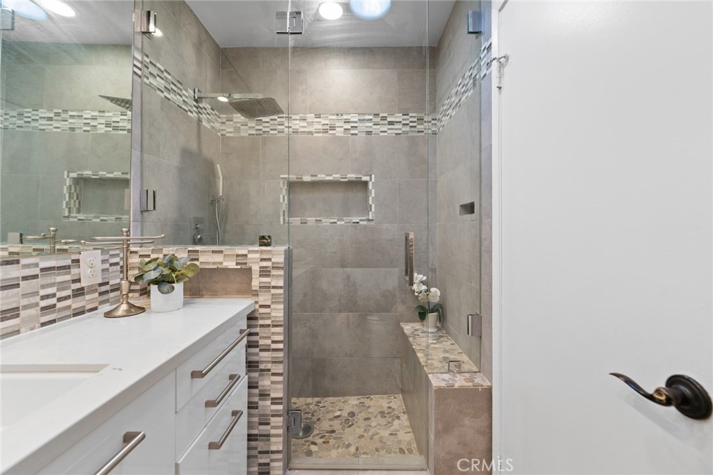 7 Boone Irvine, CA 92620 - Photo 32 of 38 a bathroom with a sink shower and a mirror