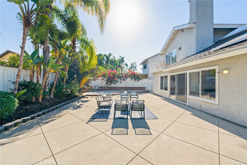 7 Boone Irvine, CA 92620 - Photo 36 of 38 a patio with table and chairs and potted plants