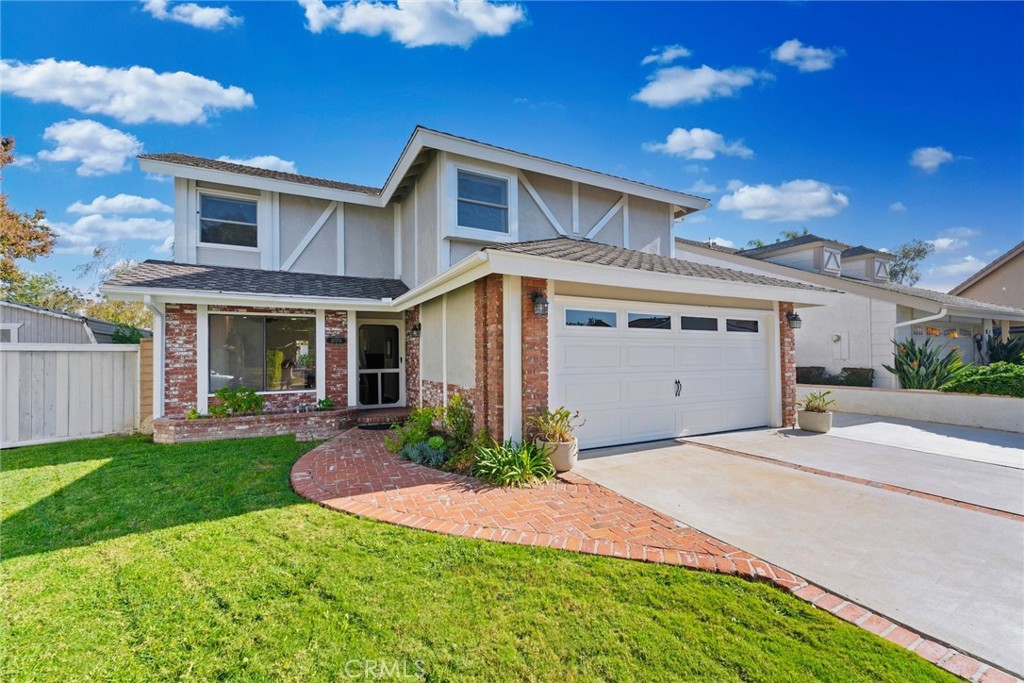 7 Boone Irvine, CA 92620 - Photo 6 of 38 a front view of a house with a yard and garage