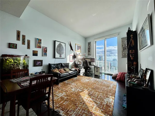 a living room with furniture fireplace and flat screen tv