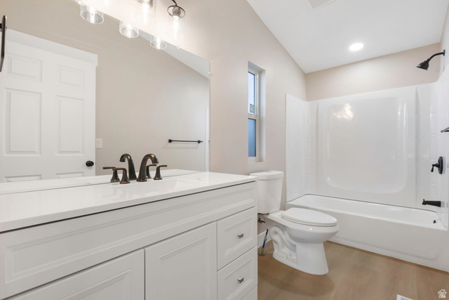 96 Barrington Way Layton, UT 84041 - Photo 14 of 28 Full bath featuring vanity, tub / shower combination, and light wood-type flooring