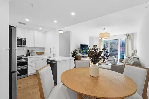 a kitchen with a table and chairs