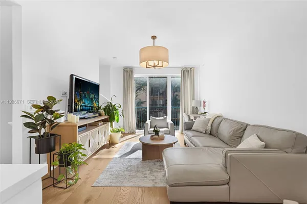 a living room with furniture fireplace and flat screen tv