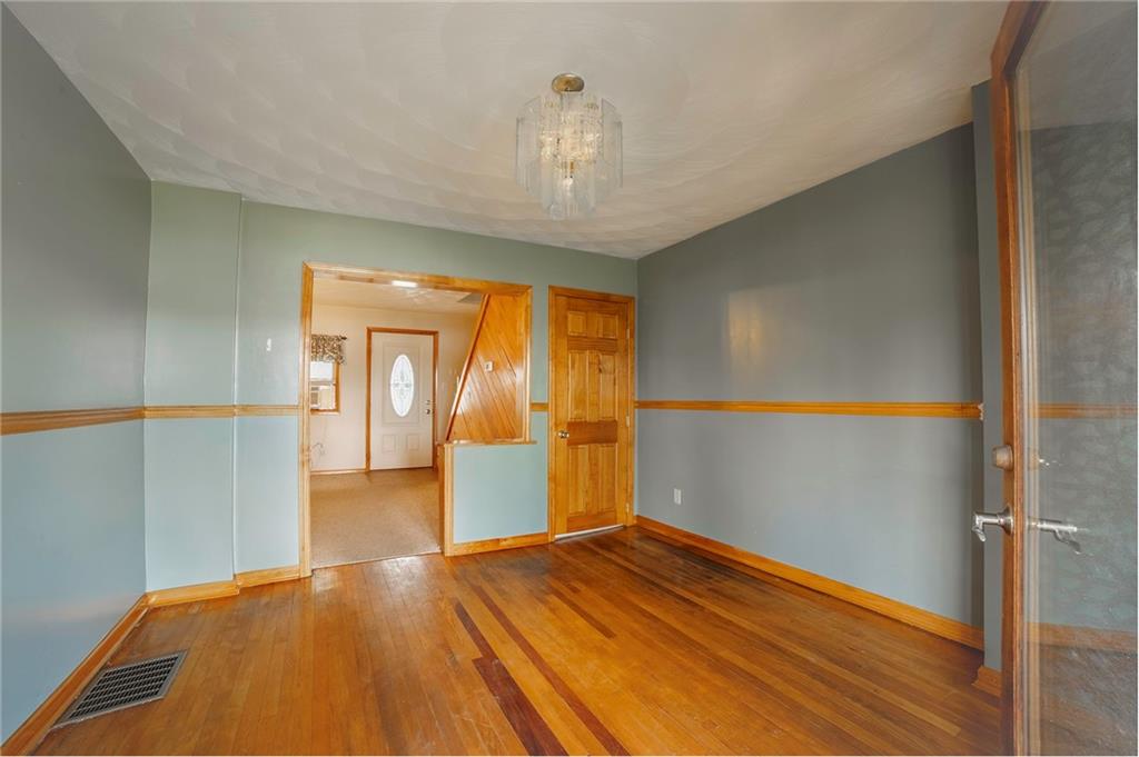 116 10th Street Lucerne Mines, PA 15754 - Photo 5 of 20 wooden floor in an empty room with a window