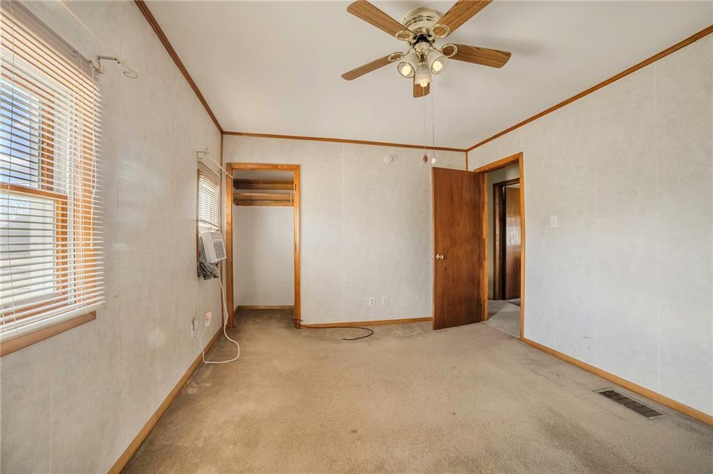 116 10th Street Lucerne Mines, PA 15754 - Photo 10 of 20 a view of a livingroom with a ceiling fan and window