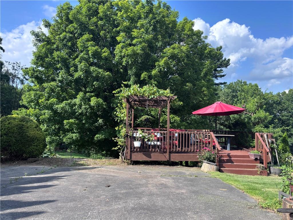 257 Johnston Road Pittsburgh, PA 15241 - Photo 23 of 29 a view of a patio with a table and chairs under an umbrella