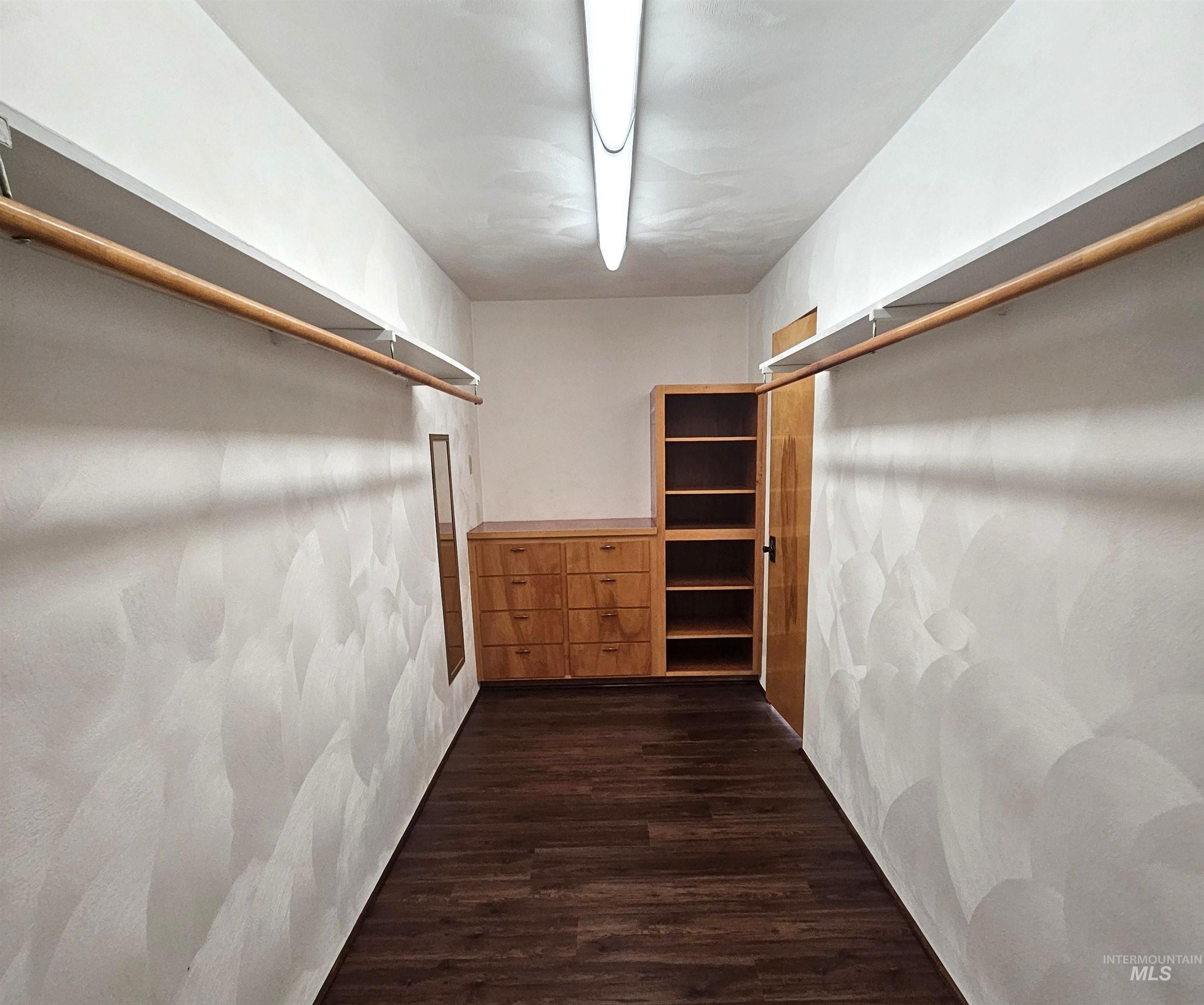 29865 Mission Creek Road Culdesac, ID 83524 - Photo 31 of 43 Walk-in closet featuring wood-finish flooring and integrated shelving