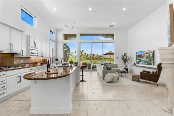 a kitchen with counter top space and stainless steel appliances