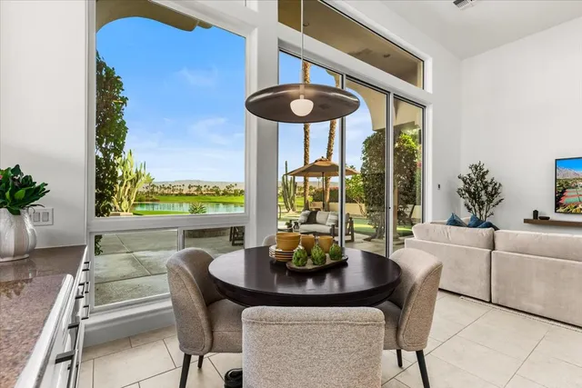 a view of a dining room with furniture window and outside view
