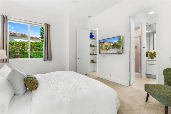 a bedroom with a bed and a couch