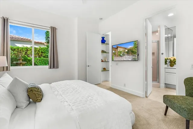 a bedroom with a bed and a couch