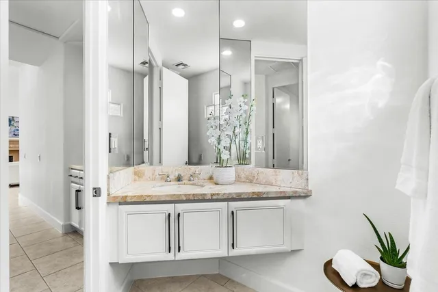 a bathroom with a sink a double vanity and a mirror