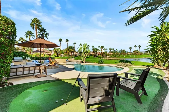 a view of a patio with chairs and a table