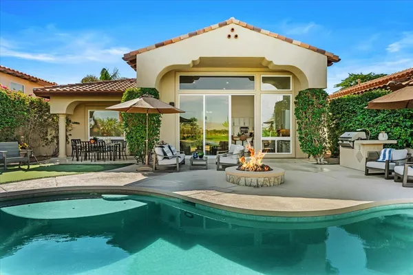 a front view of a house with swimming pool