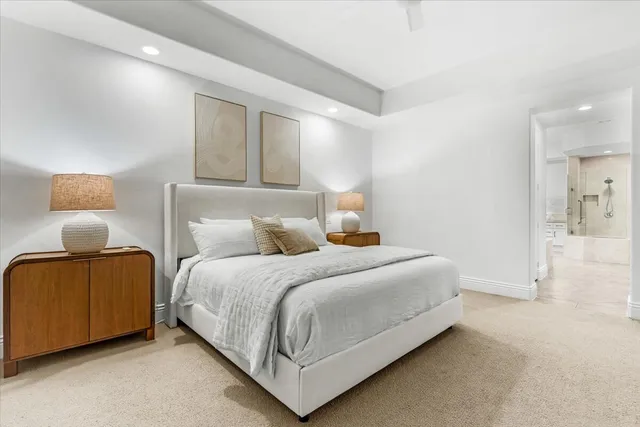 a bedroom with a bed and lamp