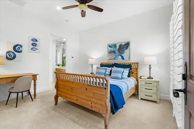 a bed room with a bed and a chair