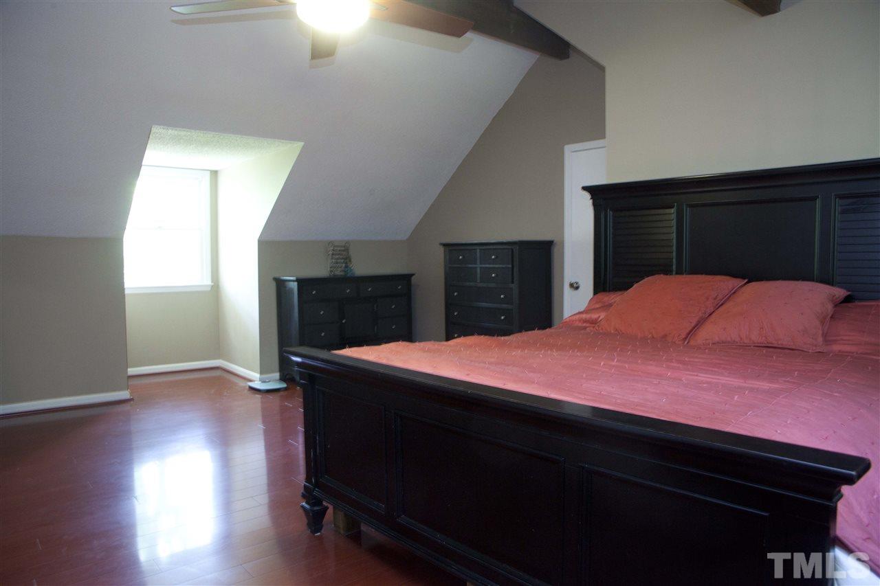 707 Torredge Road Durham, NC 27712 - Photo 17 of 21 a bedroom with a bed and a dresser