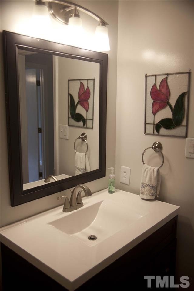 707 Torredge Road Durham, NC 27712 - Photo 9 of 21 a bathroom with a sink and a mirror