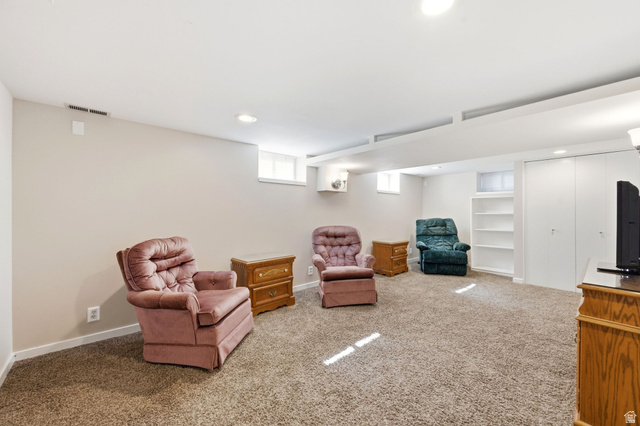 310 East 600 South Centerville, UT 84014 - Photo 17 of 41 Carpeted recreation room featuring neutral painted walls, recessed lighting, and high ceilings