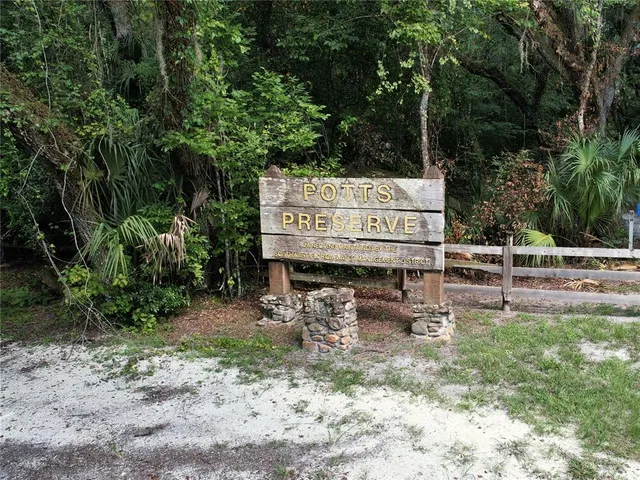 a view of swimming pool with a bench and lake view