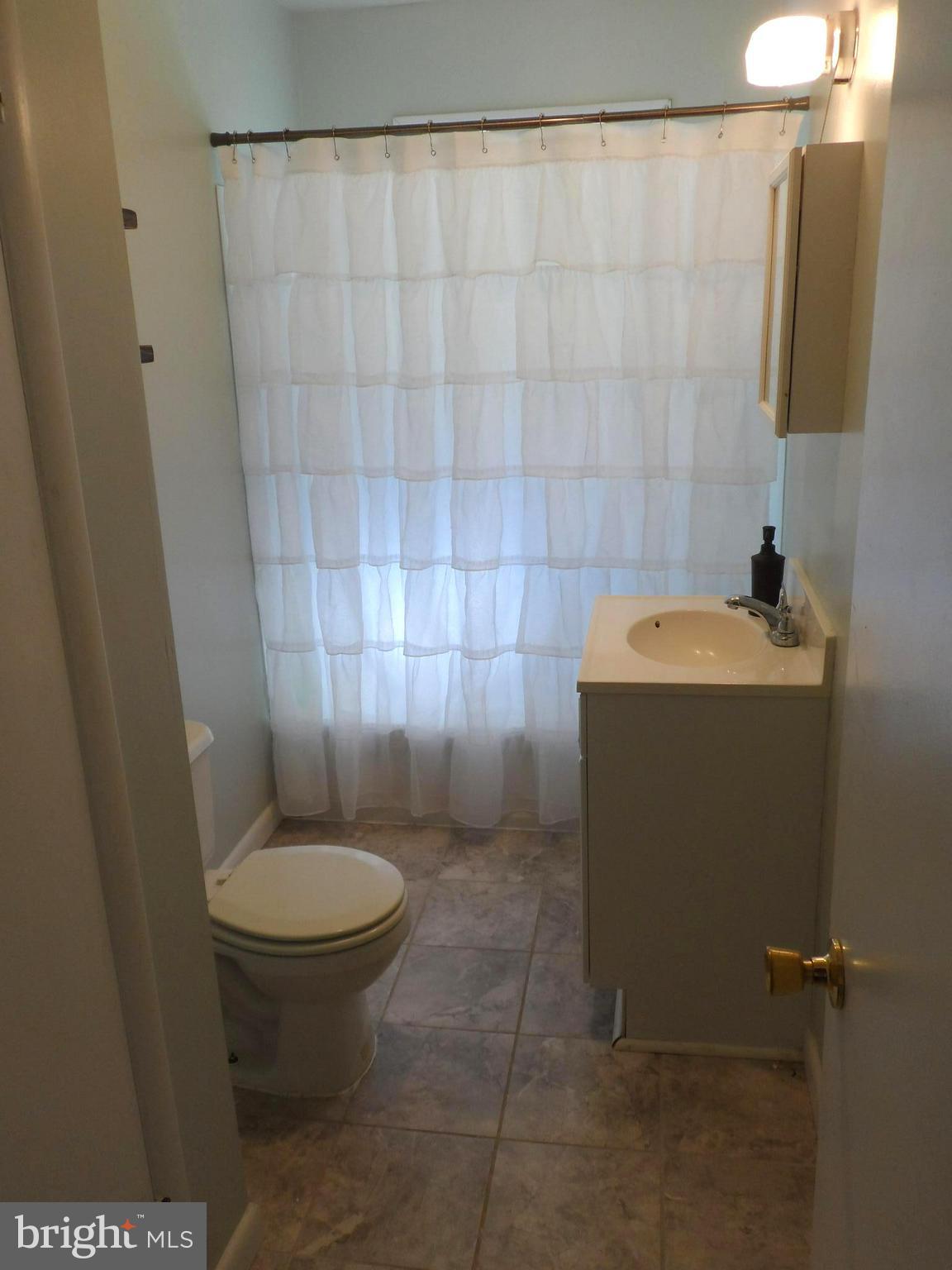 15339 Bishop Road King George, VA 22485 - Photo 8 of 9 Hall Bath with Tile Floor