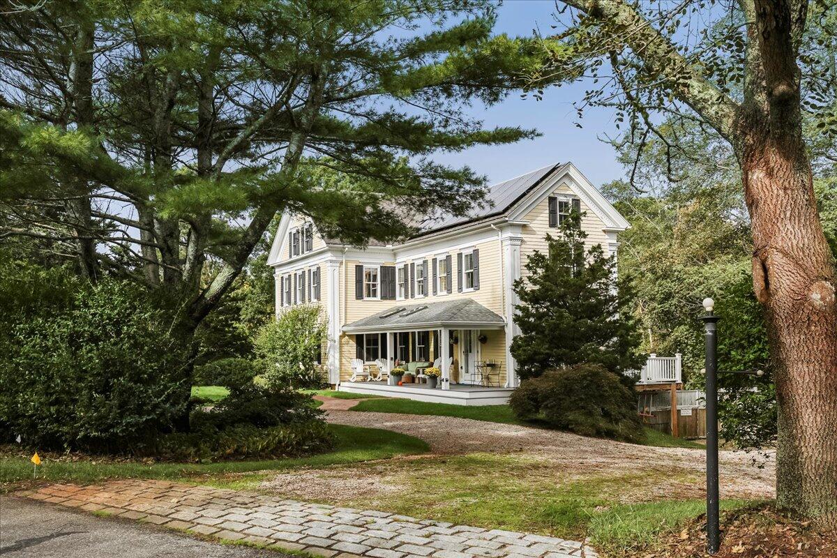 700 Samoset Road Eastham, MA 02642 - Photo 1 of 41 a front view of a house with a garden
