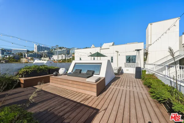 a view of a balcony with wooden floor
