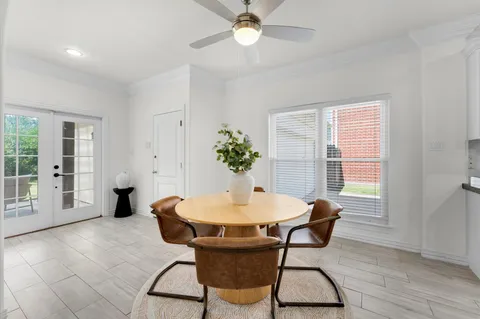 a spacious bathroom with a granite countertop sink a toilet and shower