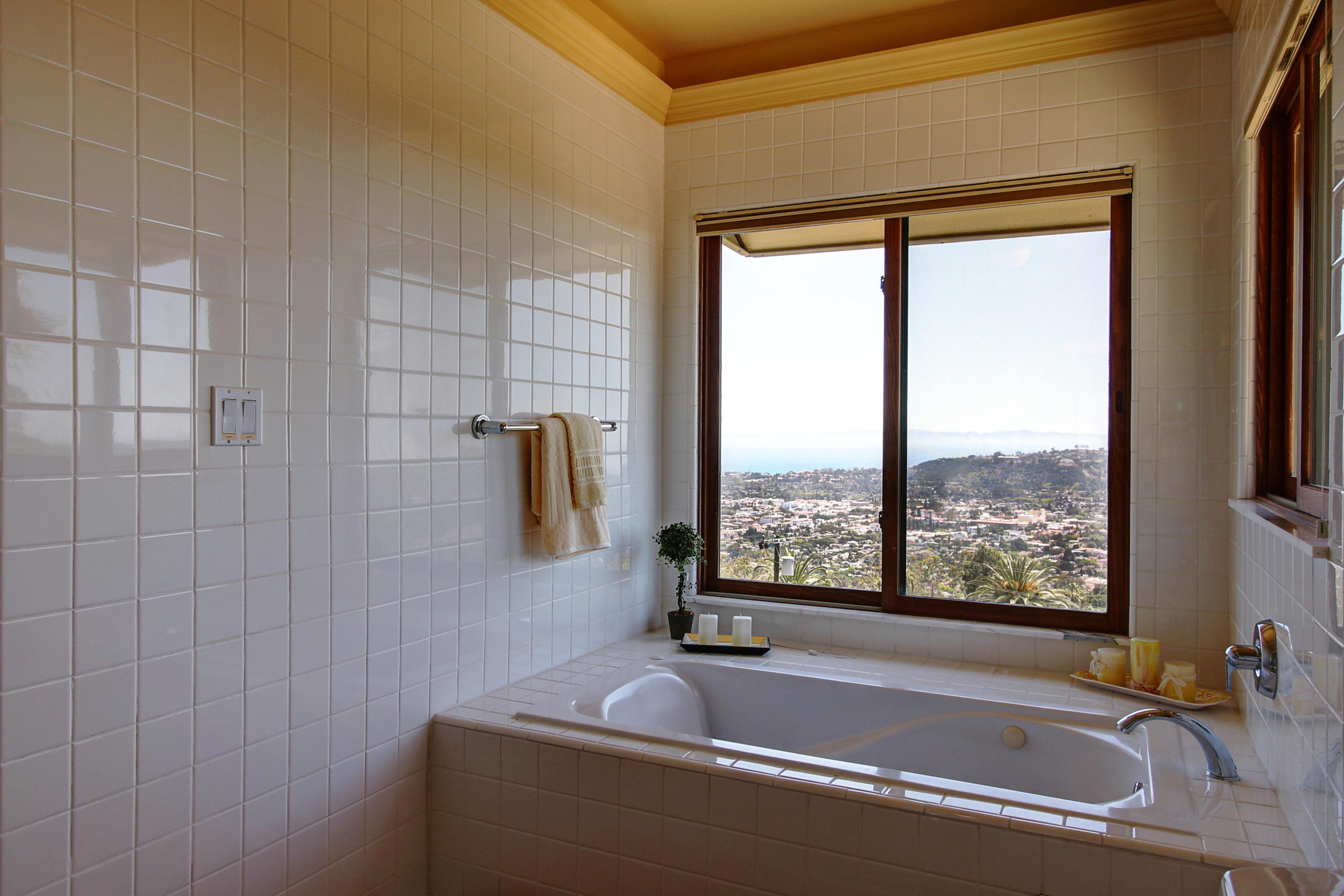 1710 Mission Ridge Road Santa Barbara, CA 93103 - Photo 12 of 27 a bath tub sitting next to a window