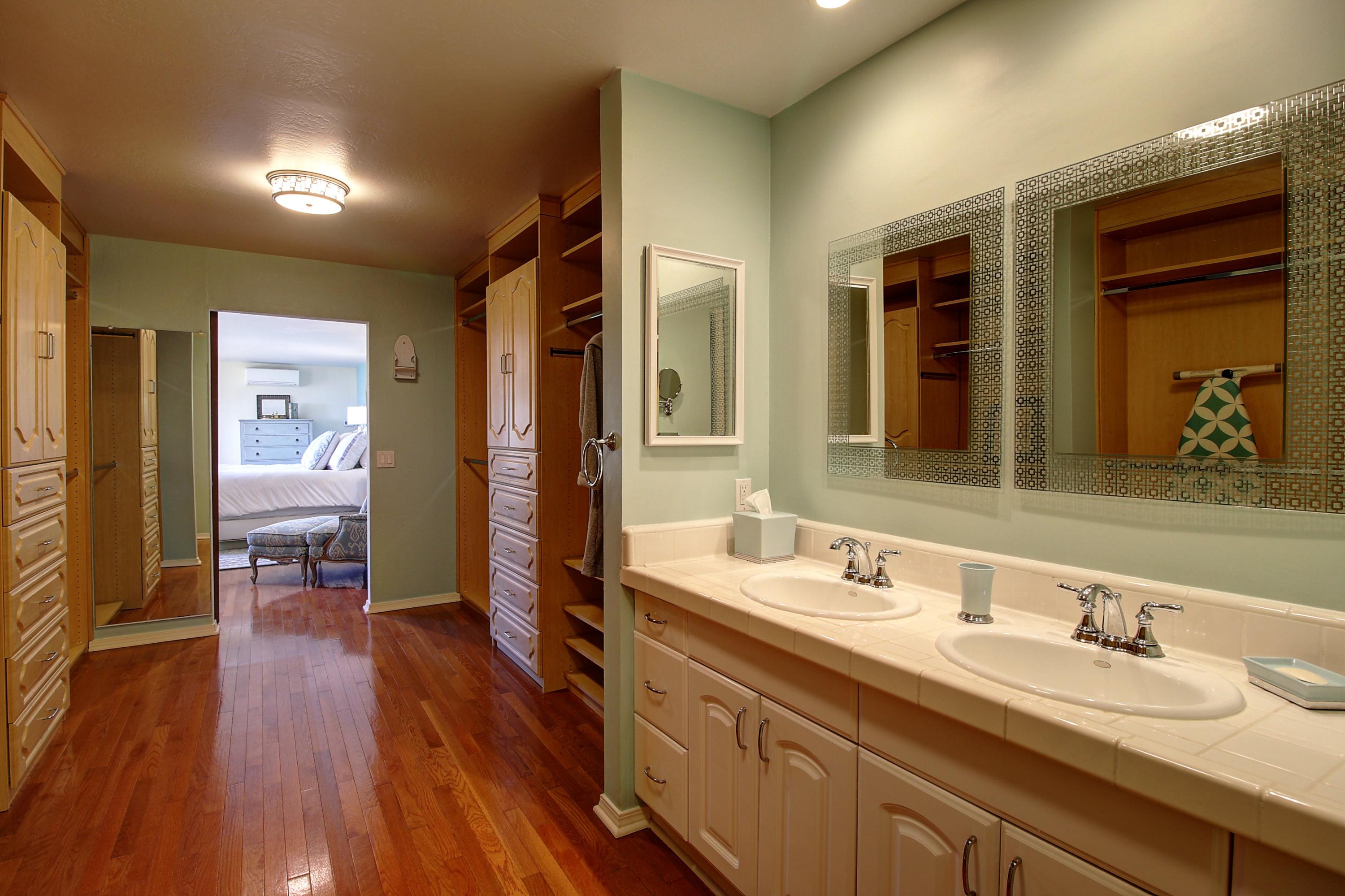 1710 Mission Ridge Road Santa Barbara, CA 93103 - Photo 15 of 27 a spacious bathroom with a granite countertop sink and a mirror