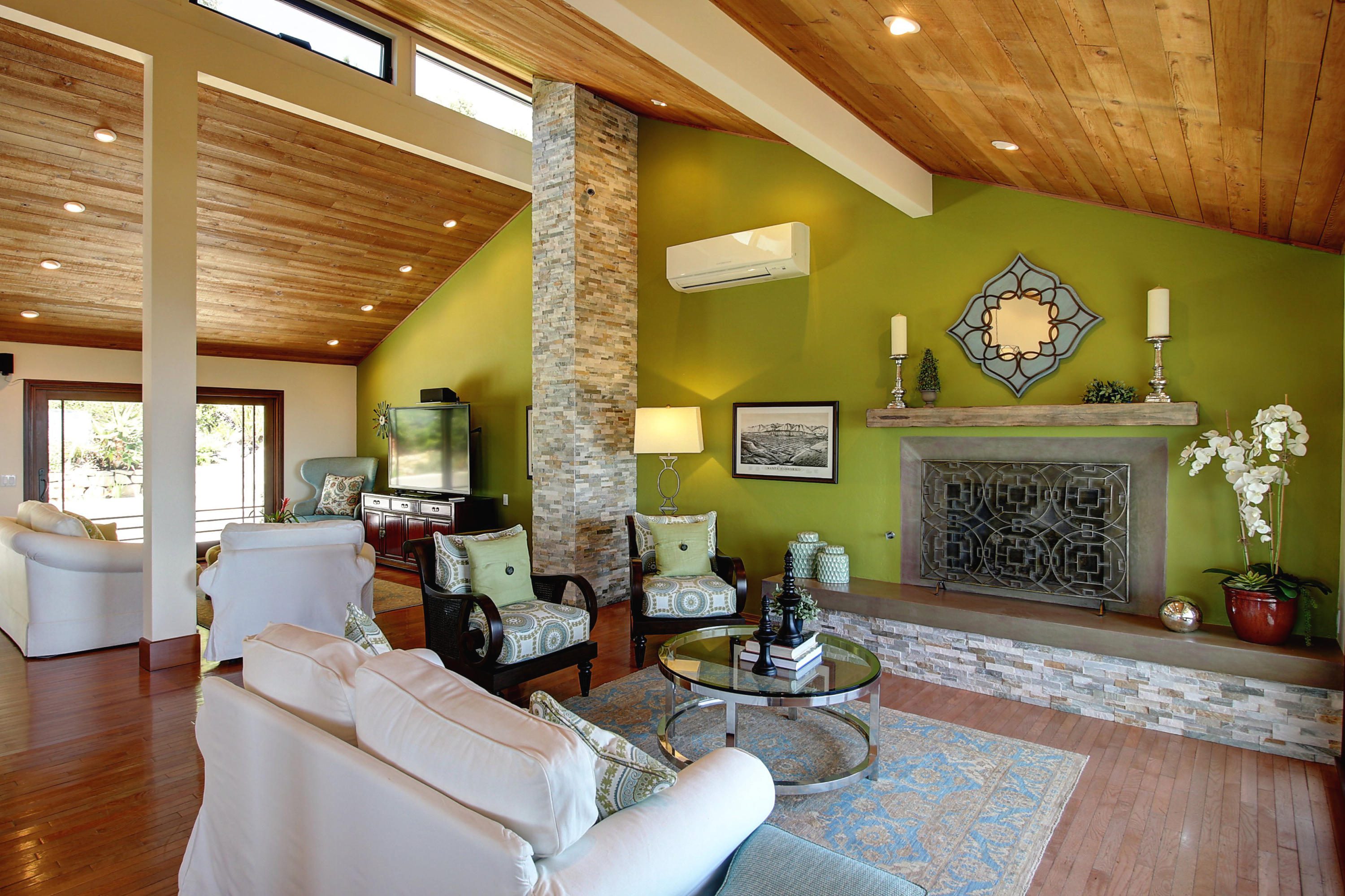 1710 Mission Ridge Road Santa Barbara, CA 93103 - Photo 6 of 27 a living room with furniture a fireplace and a table