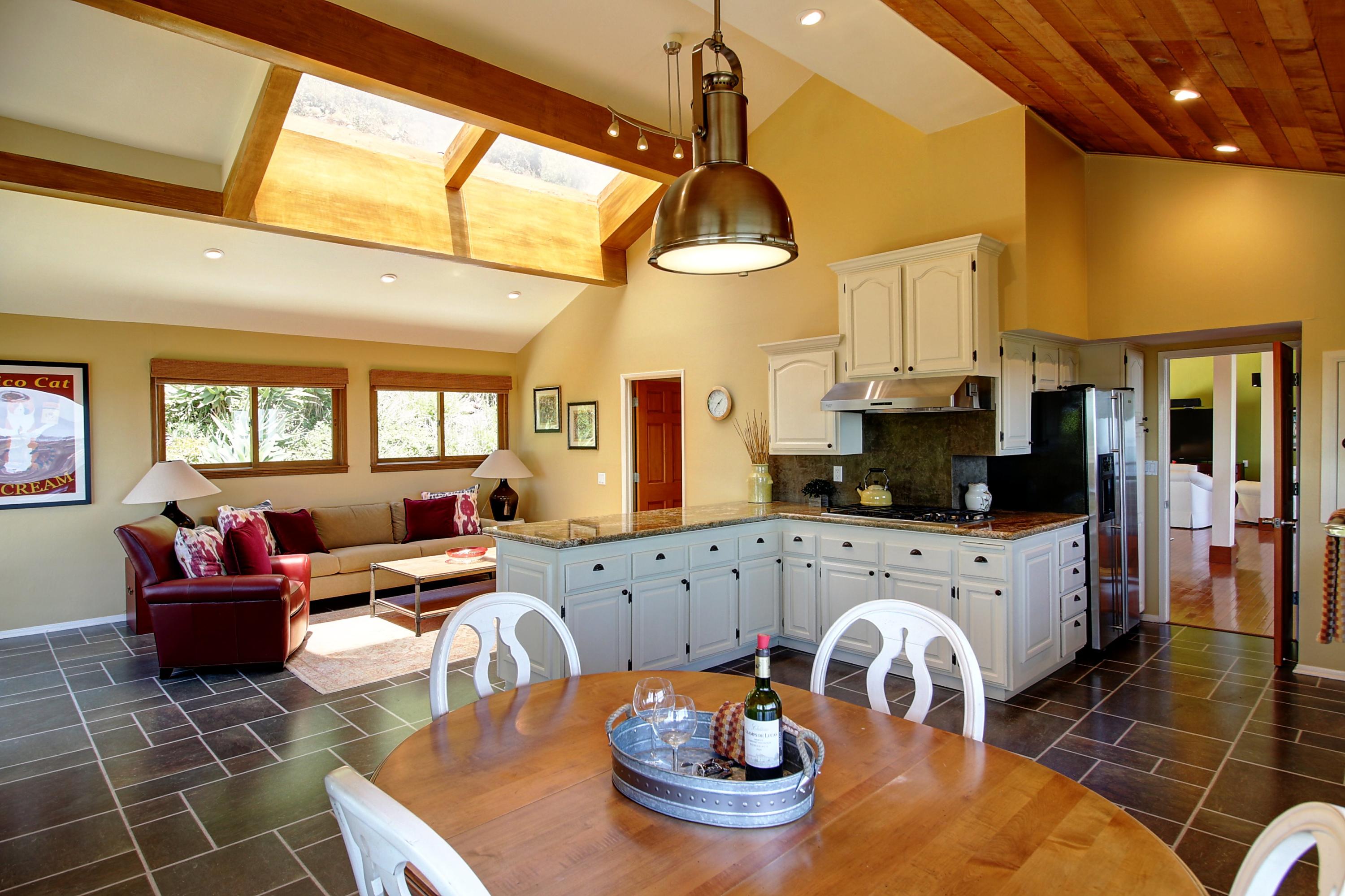 1710 Mission Ridge Road Santa Barbara, CA 93103 - Photo 7 of 27 a large kitchen with a table and chairs
